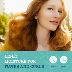 Creamy lather in hand from Maui Moisture shampoo for daily curl care