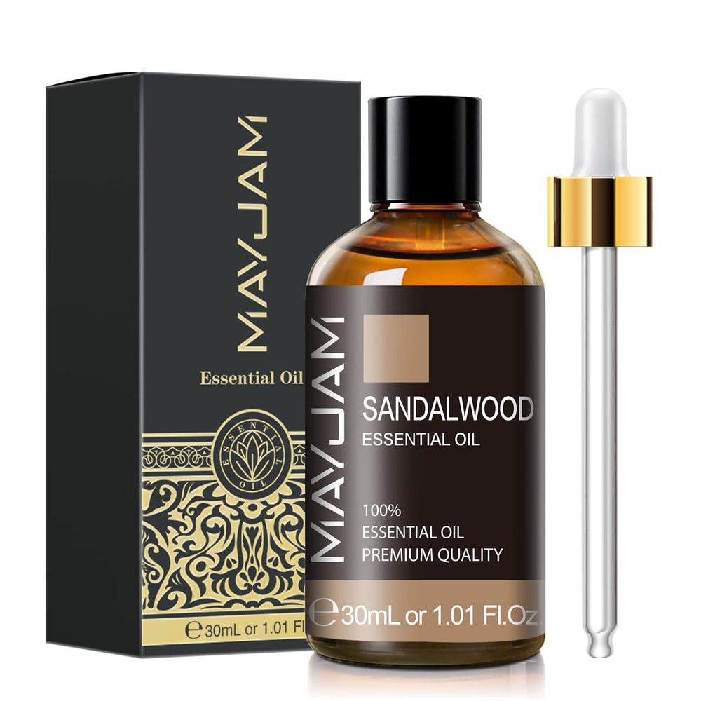 MAYJAM Sandalwood Essential Oil bottle beside a diffuser for calming aromas.