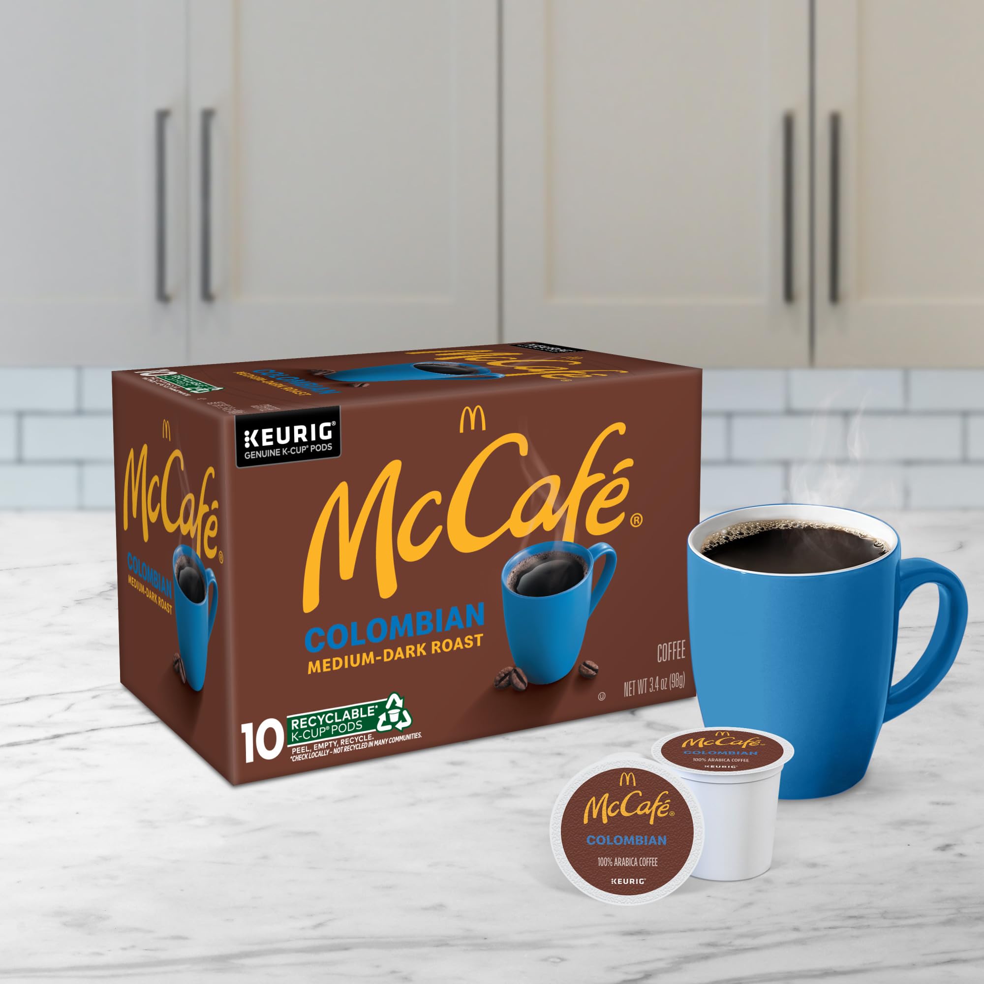 Six-pack display of McCafé Colombian pods for bulk convenience.