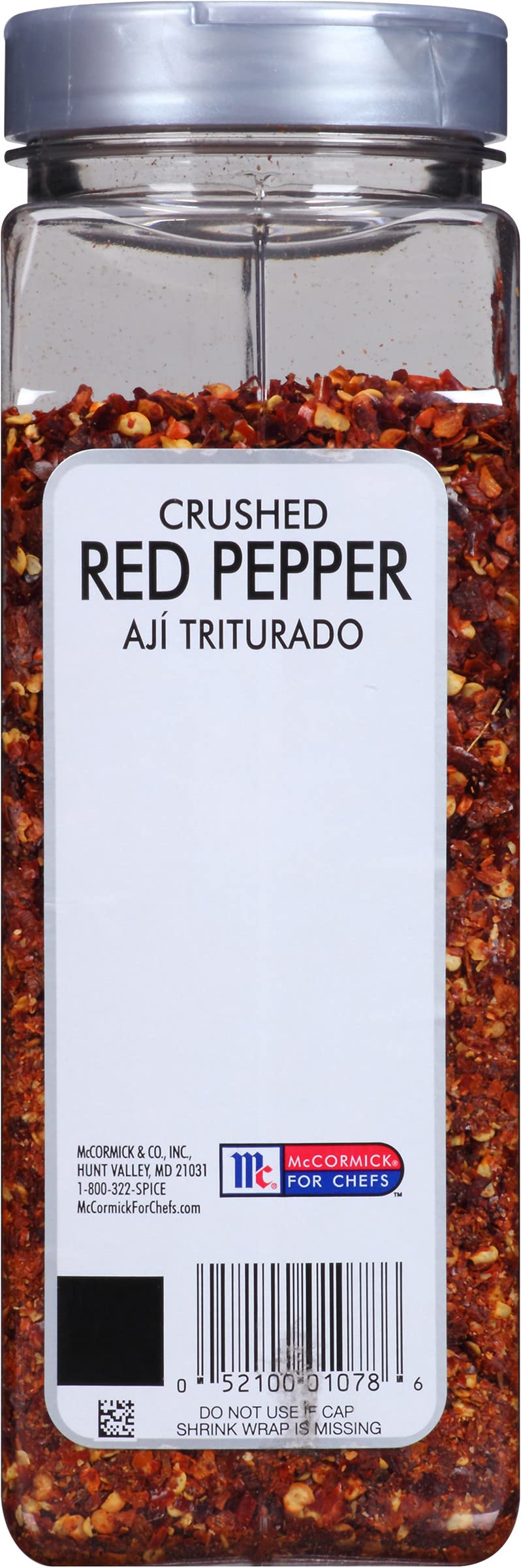 McCormick Culinary crushed red pepper with other spices in a well-stocked pantry.