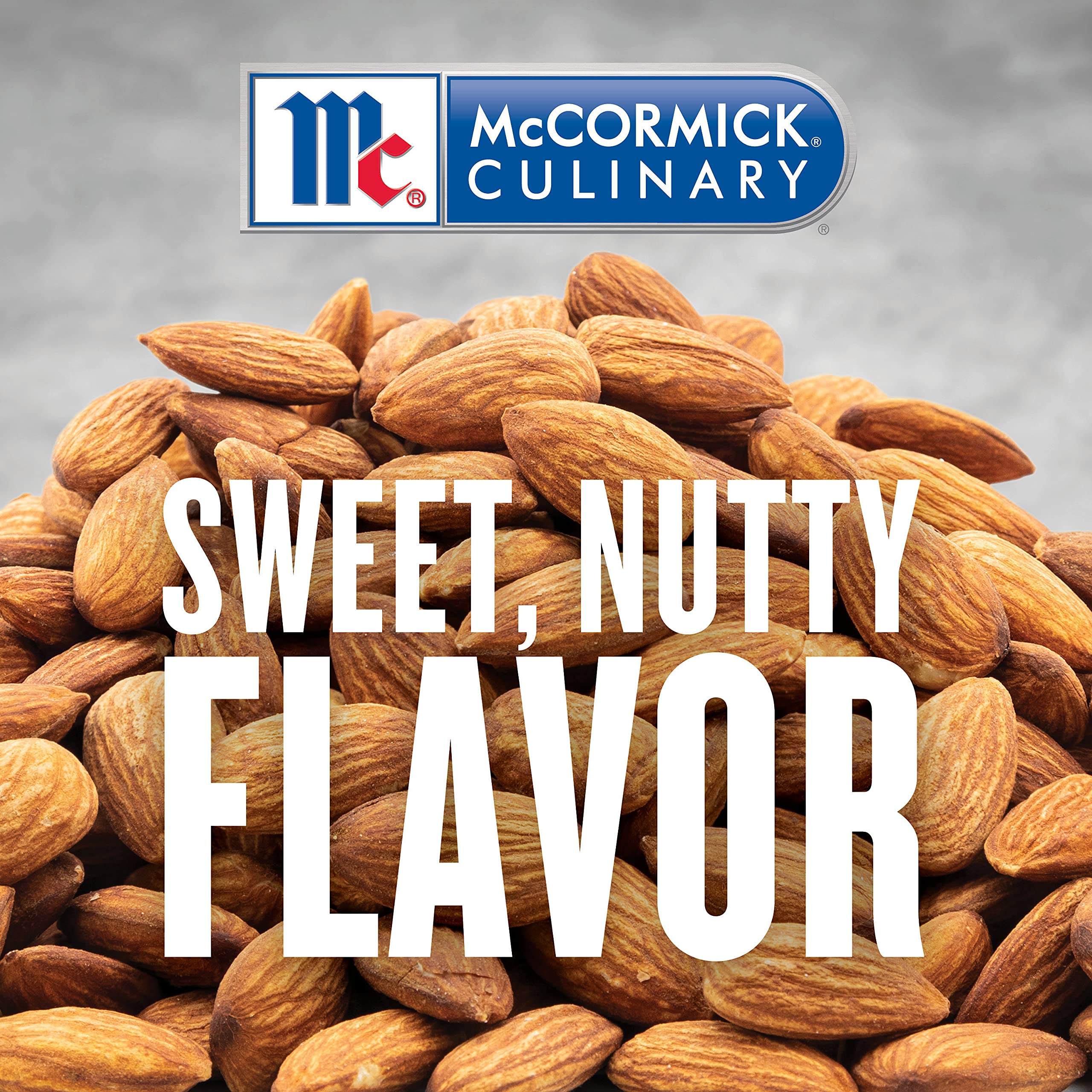 McCormick Culinary imitation almond extract being poured for precise flavoring in large batches.