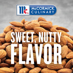 McCormick Culinary imitation almond extract being poured for precise flavoring in large batches.