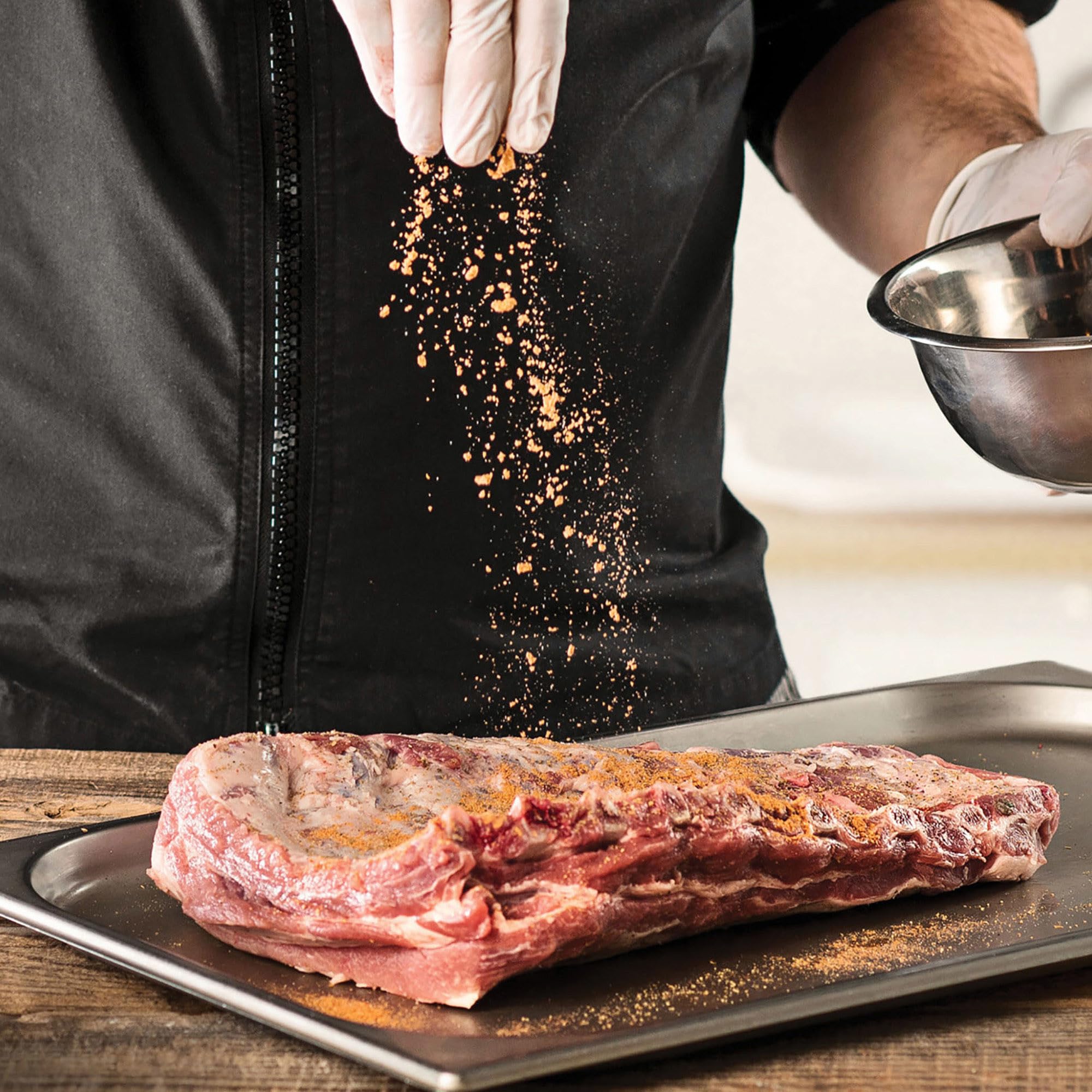 McCormick Grill Mates Smokehouse Maple being used as a dry rub on meat.