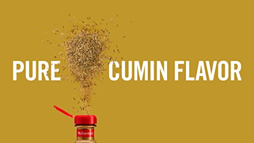 McCormick Ground Cumin dusting over roasted vegetables.