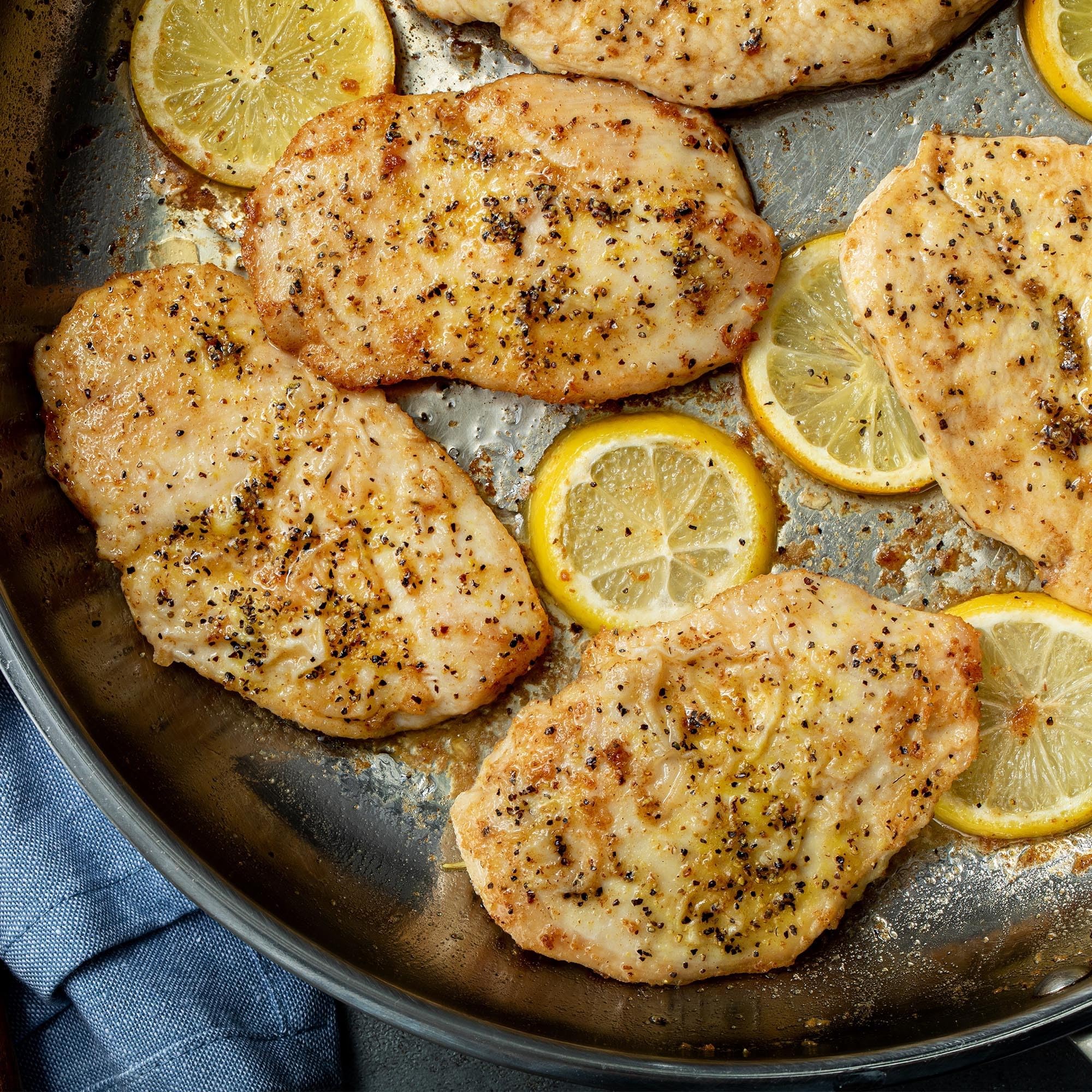 Closeup of McCormick Perfect Pinch Lemon Pepper on seafood ready for grilling.
