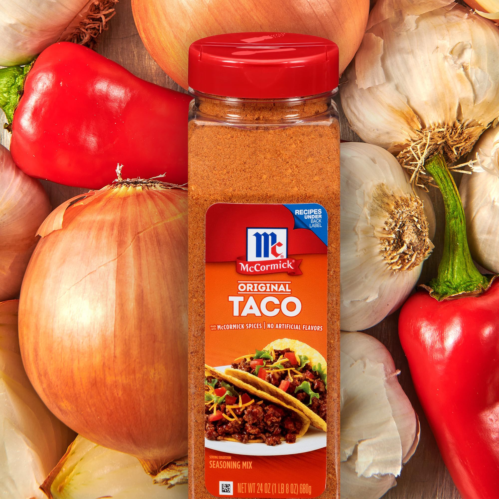 Measuring spoon over a dish ready for McCormick Original Taco Seasoning.