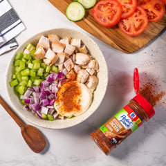 McCormick Perfect Pinch Rotisserie Chicken Seasoning on plate with roasted chicken