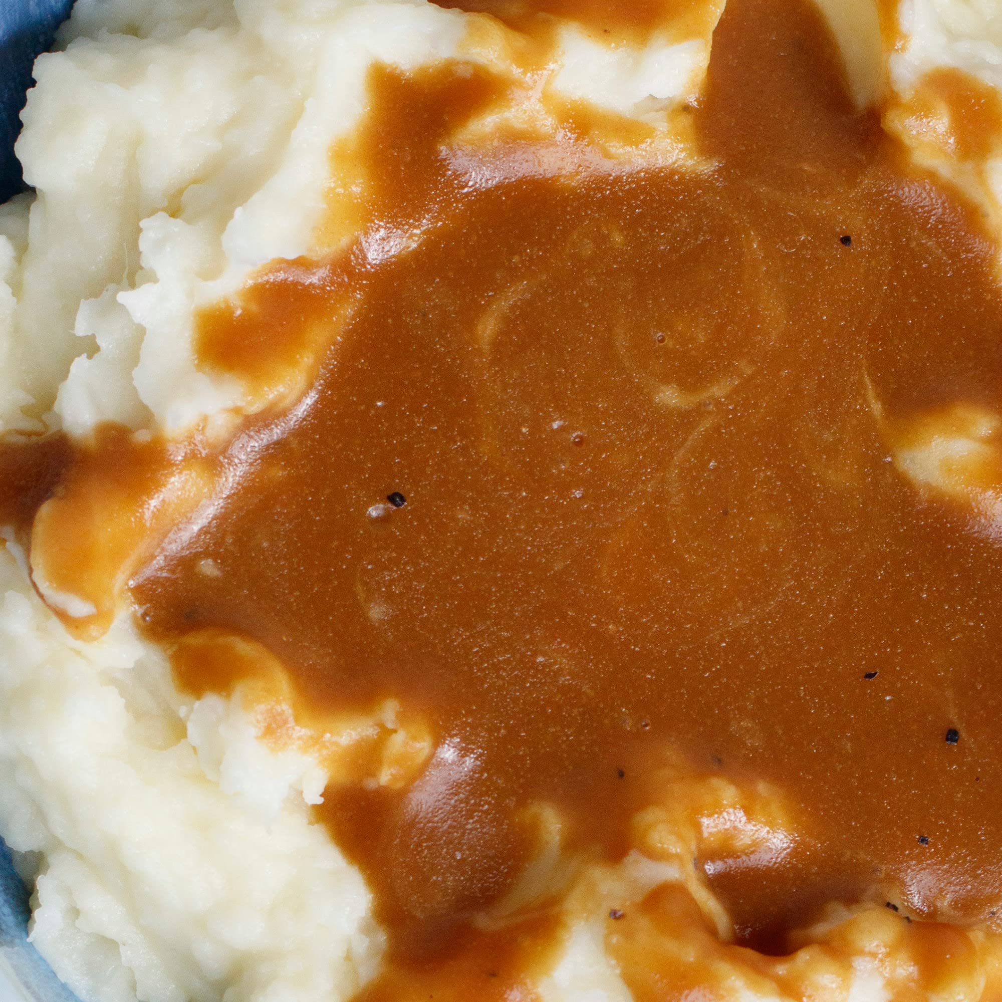 McCormick Premium Brown Gravy Mix over turkey adds savory depth to meals