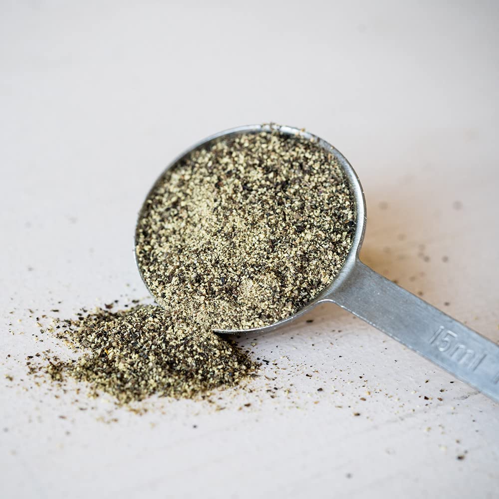 McCormick Table Grind Black Pepper sprinkles into a stew, elevating aroma and warmth