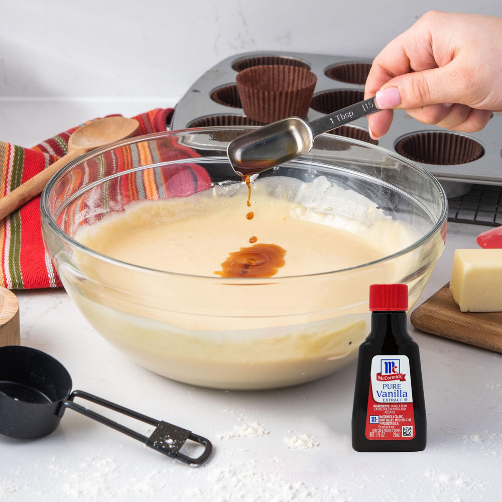 Fresh cookies cooling on a rack scented by McCormick Vanilla.