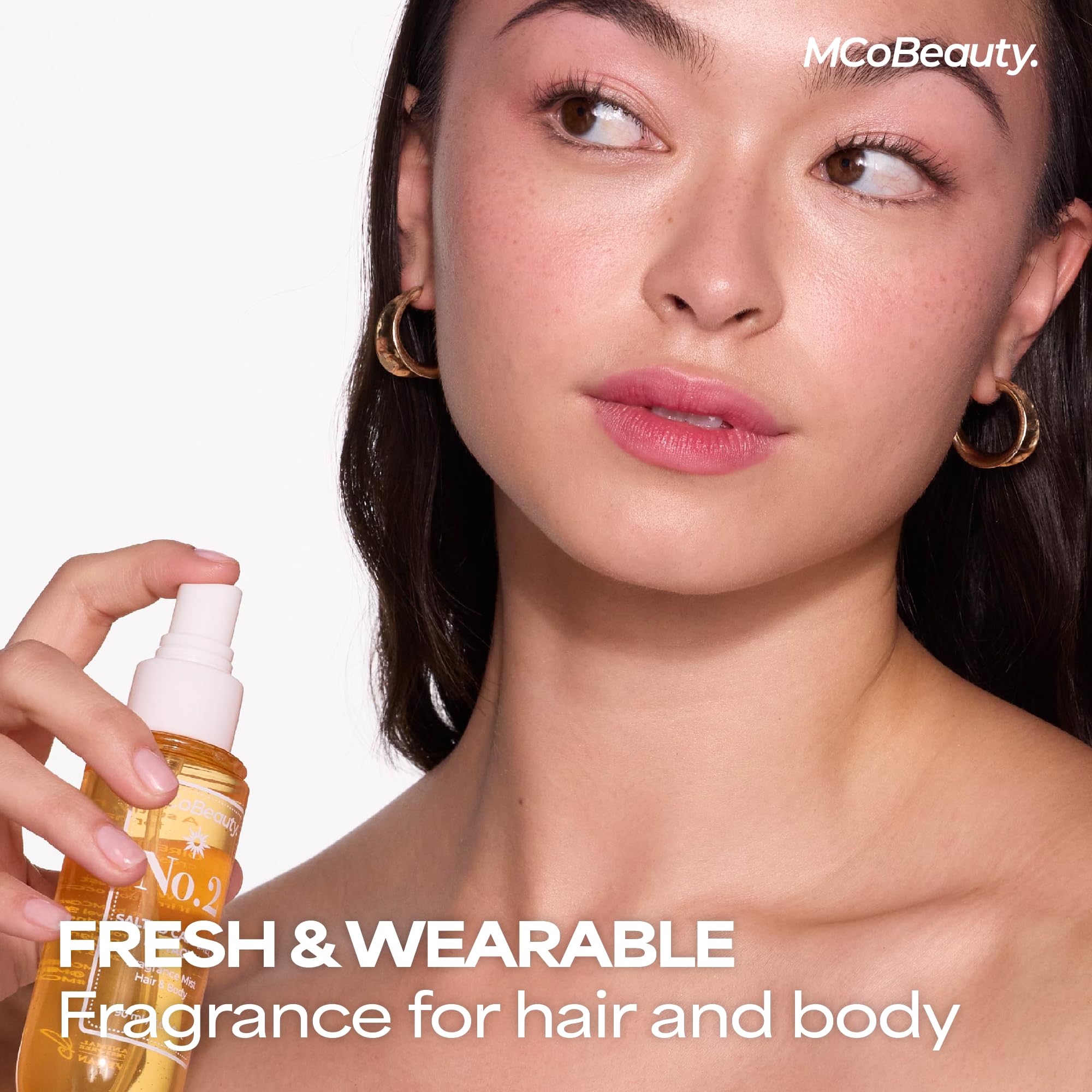 MCoBeauty Fragrance Mist No. 2 spritz on hair creates a light scent veil.