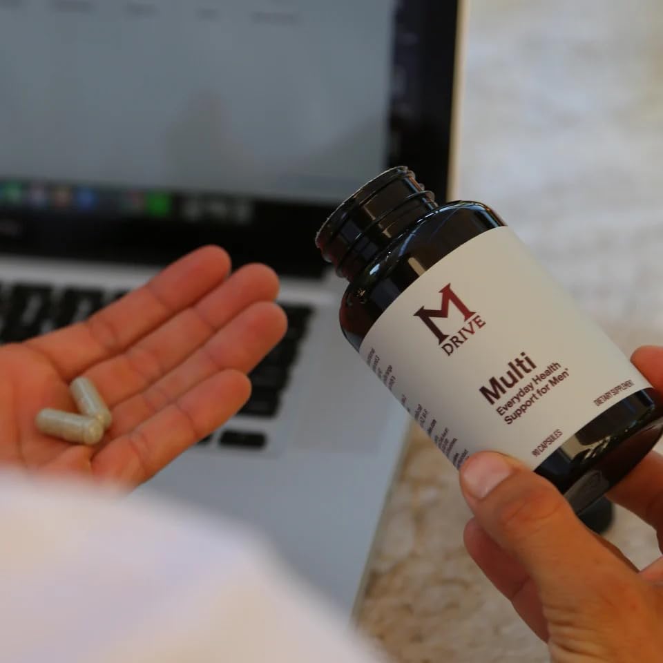 Mdrive Multivitamin for Men CoQ10 energy capsule suggesting sustained vitality.