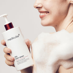 Medicube Red Body Wash label detail featuring niacinamide and acids.