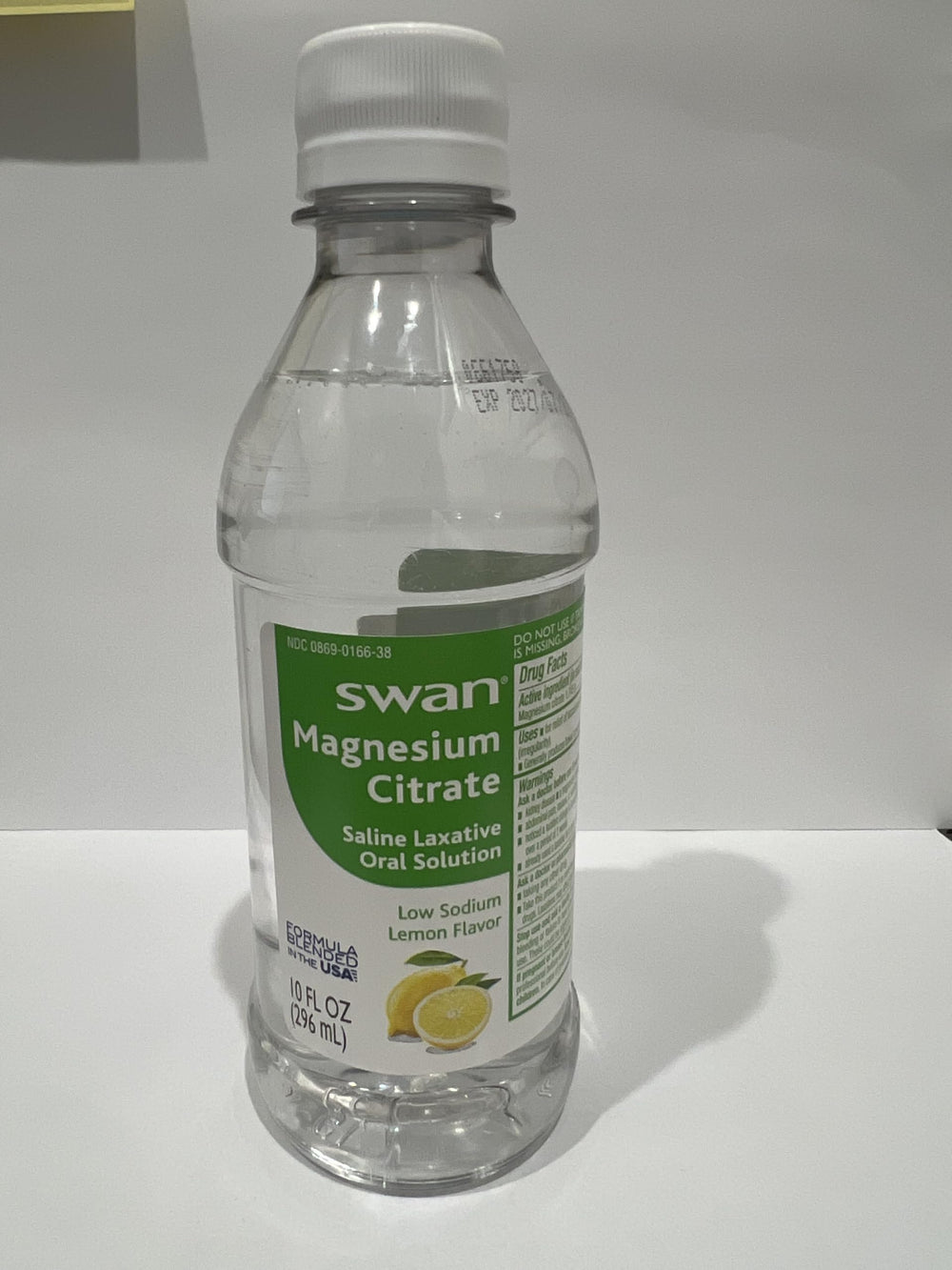 Glass with water beside the MedRite bottle, a simple hydration-friendly routine.