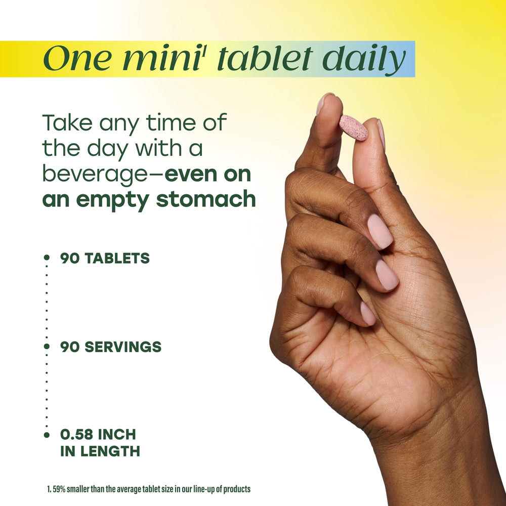 MegaFood Methyl B12 being taken with water for daily use at desk
