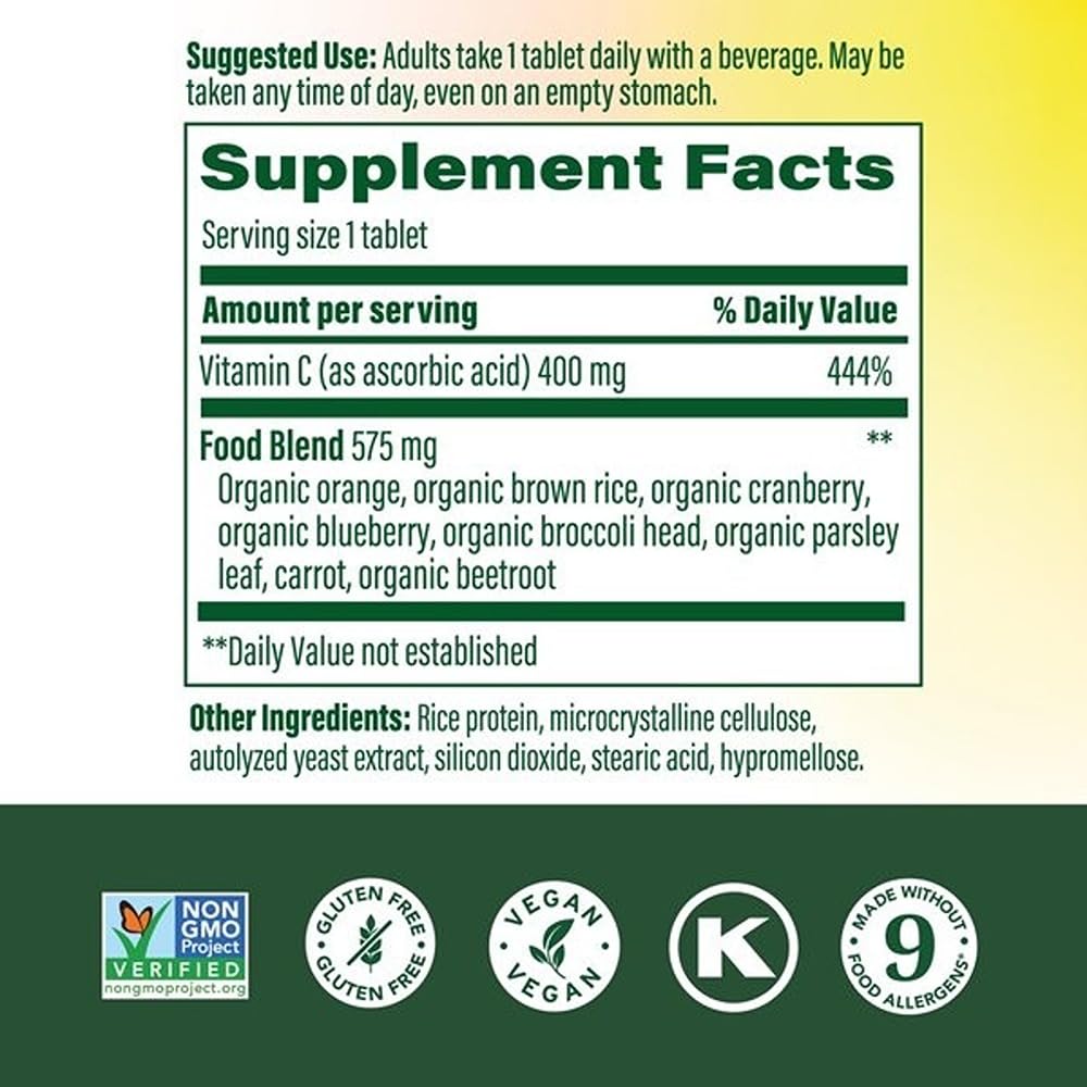 MegaFood Ultra C 400 mg tablet poured into a glass for daily immune support.
