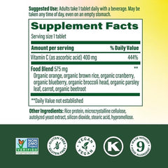 MegaFood Ultra C 400 mg tablet poured into a glass for daily immune support.