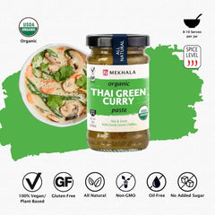 Mekhala green curry paste cooking in a simmering curry pot