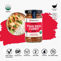 Mekhala red curry paste being poured into a pan for a quick curry base