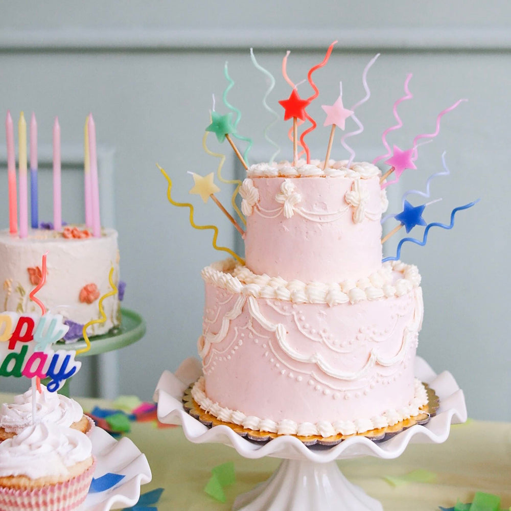 Meri Meri star candles in bright colors, perfect for colorful birthday cake celebrations.