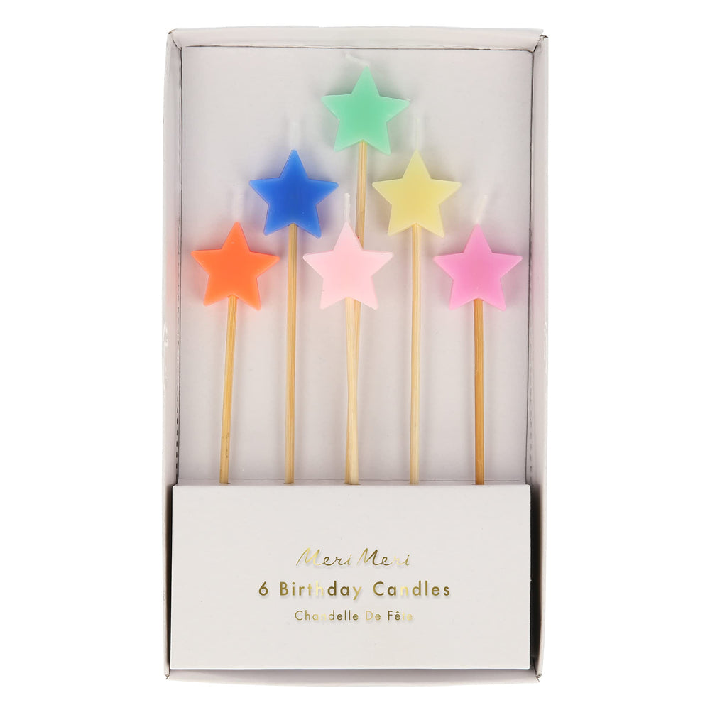 Meri Meri star candles on a cake with wooden sticks, ideal for quick festive upgrades.