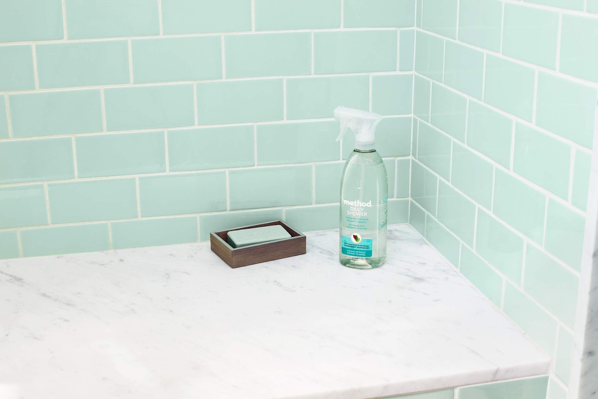 Method Daily Shower Refill bottle beside spray on shower tile shows easy maintenance.