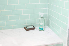 Method Daily Shower Refill bottle beside spray on shower tile shows easy maintenance.