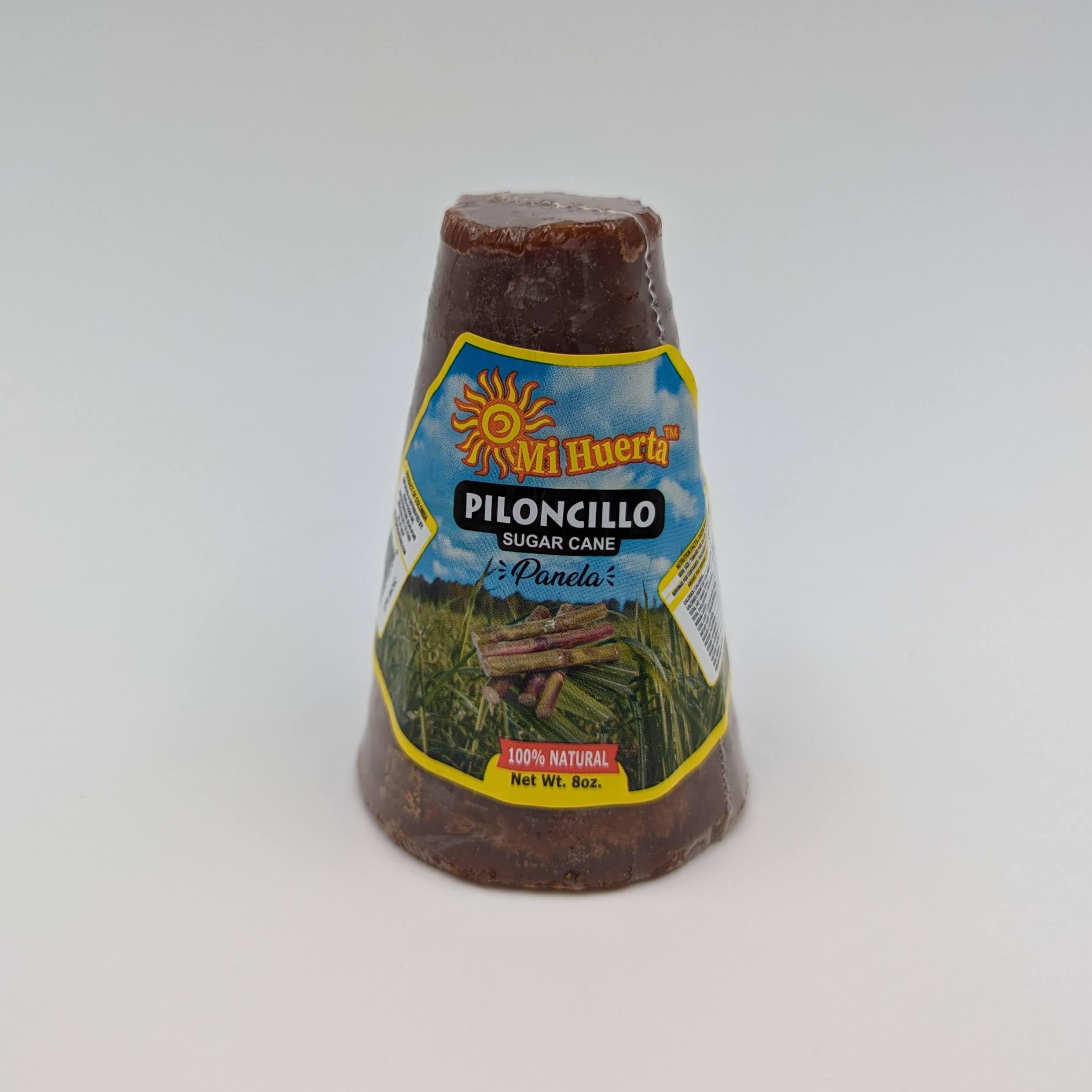 Close-up of piloncillo cone texture with rich molasses hue