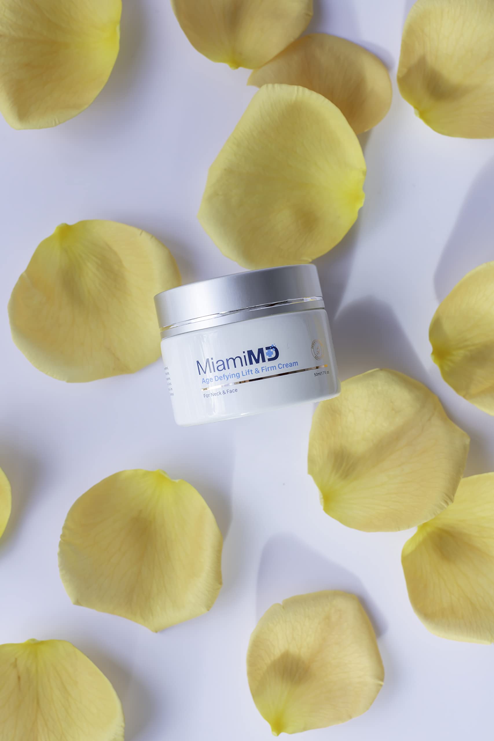 MiamiMD Age-Defying Lift & Firm Cream on dresser in a compact 1.7oz container.