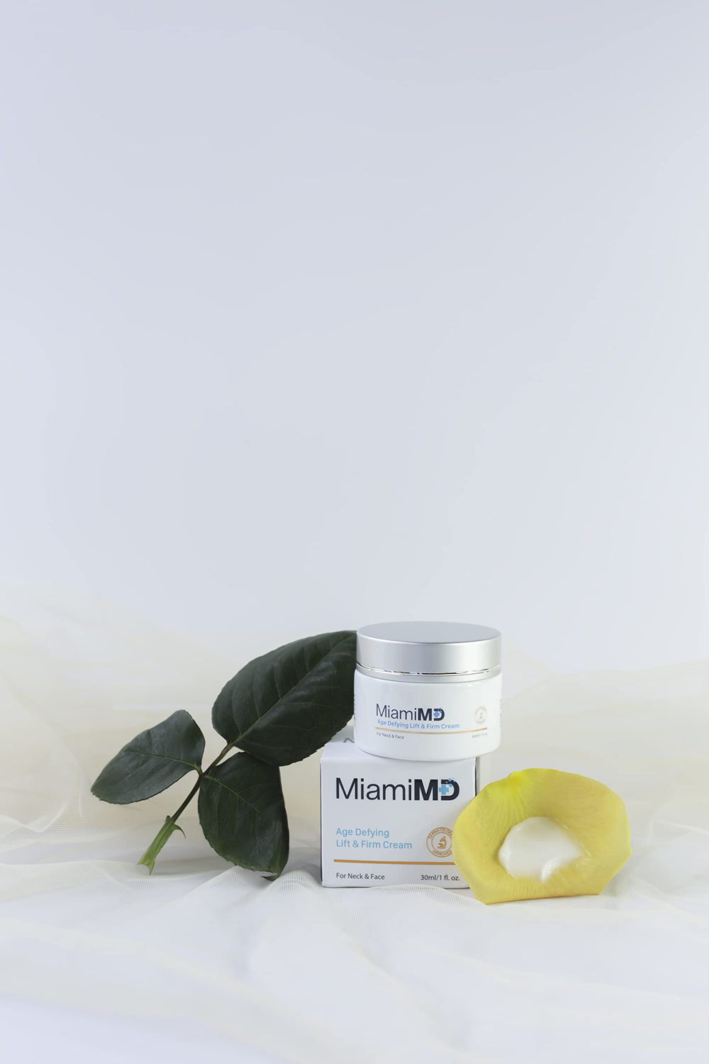 MiamiMD routine setup beside towel illustrating morning and night skincare ritual.