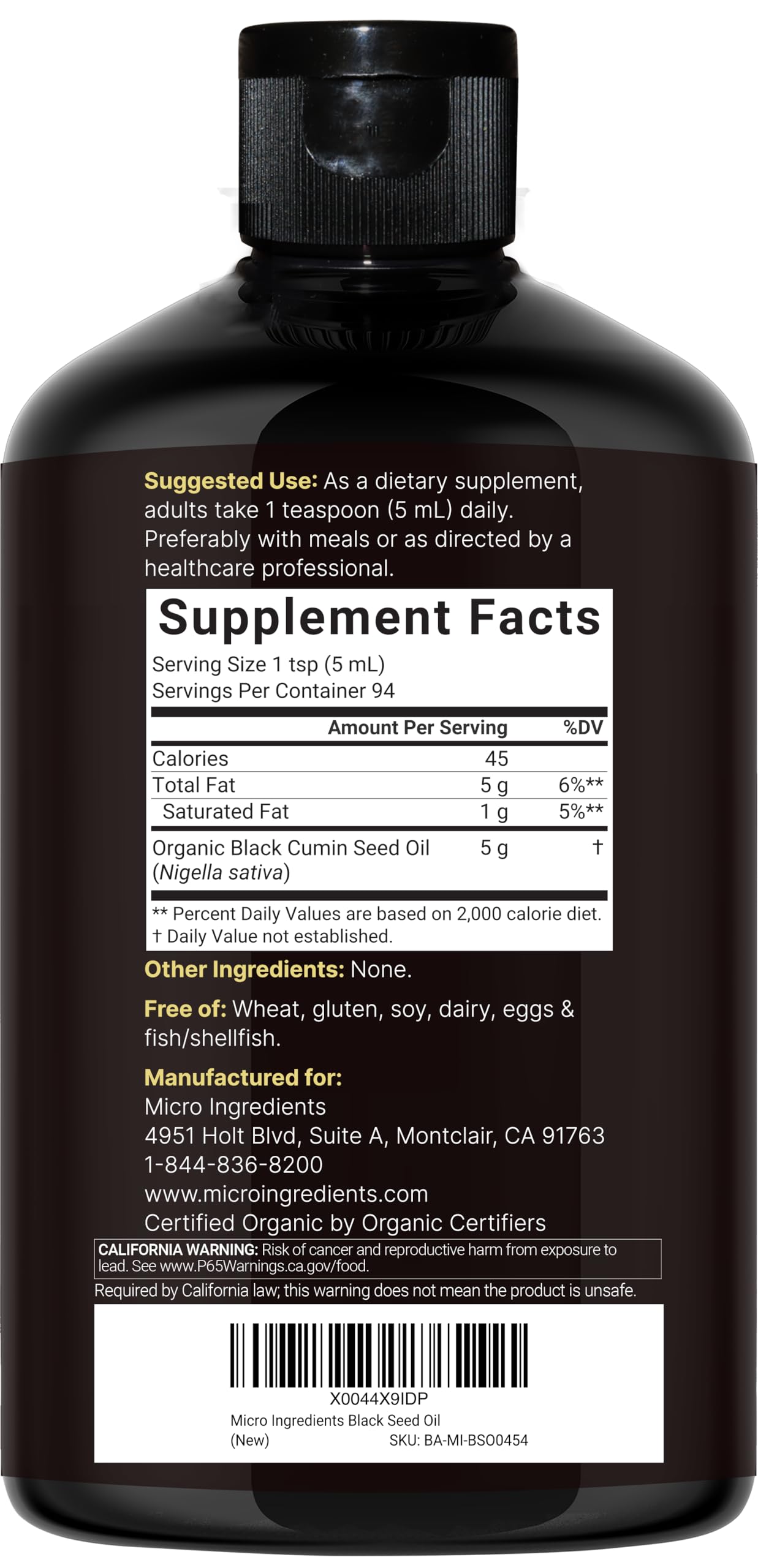 Micro Ingredients Black Seed Oil bottle pouring into a spoon for recipes.