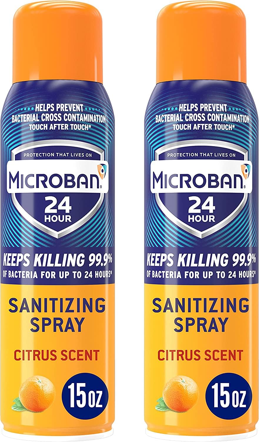 Microban sanitizing spray bottle close-up shows citrus scent and easy application