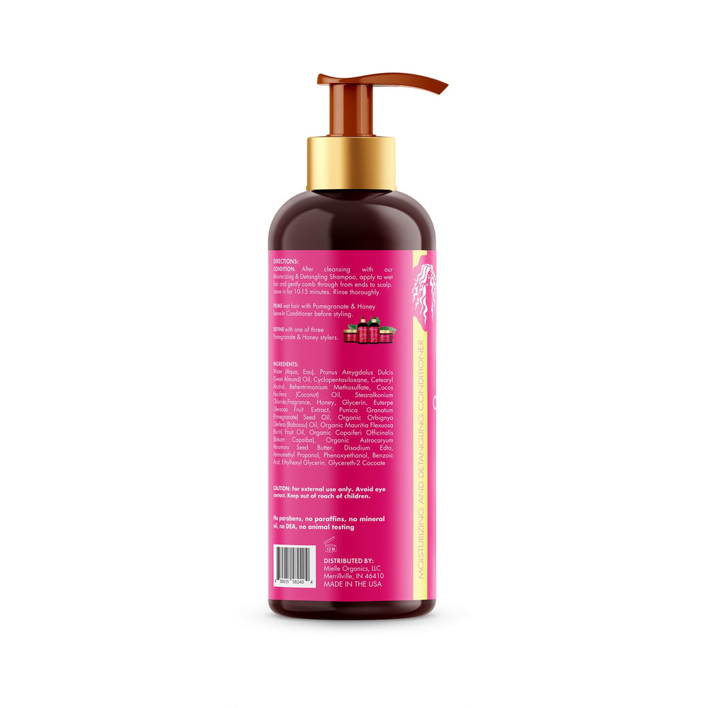 Hair application shot of Mielle Organics Pomegranate Honey detangler on curls