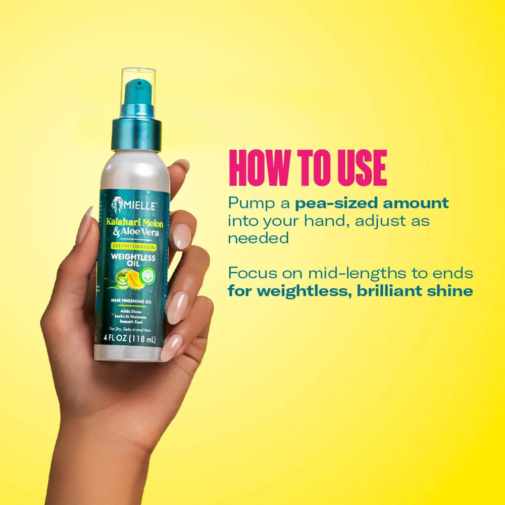 Mielle Organics Weightless Hair Oil dropper dispensing pea-sized amount.