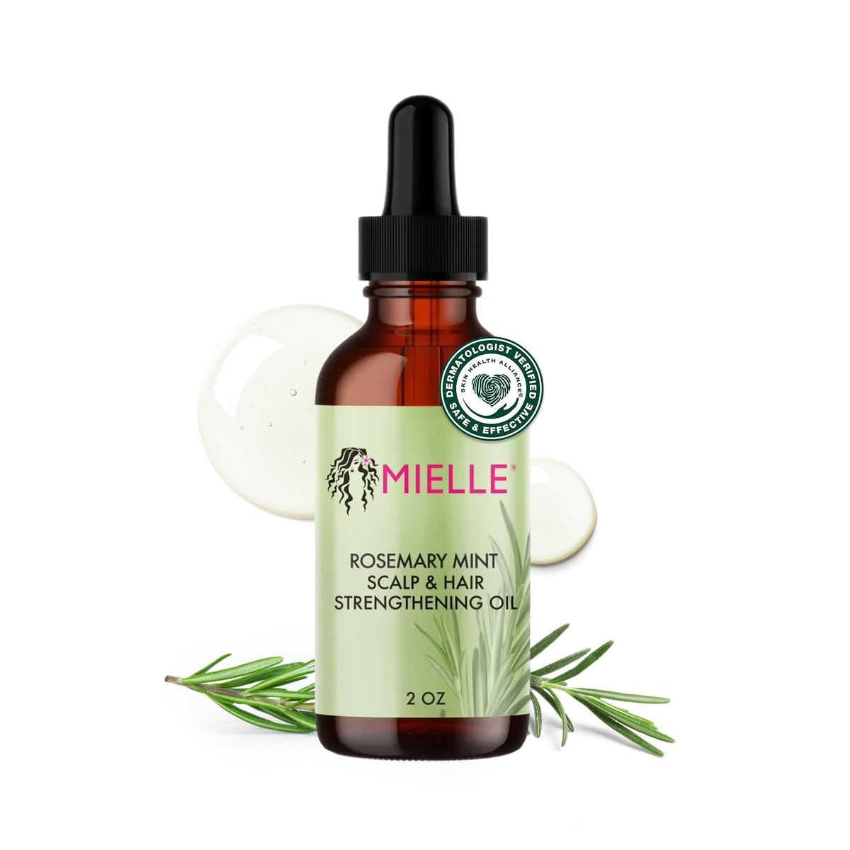 Mielle Rosemary & Mint Hair Oil bottle pour, delivering scalp nourishment and smoother strands