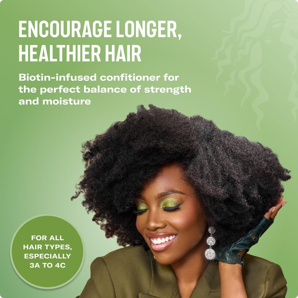 Hands apply Mielle conditioner to damp hair for smoother detangling.