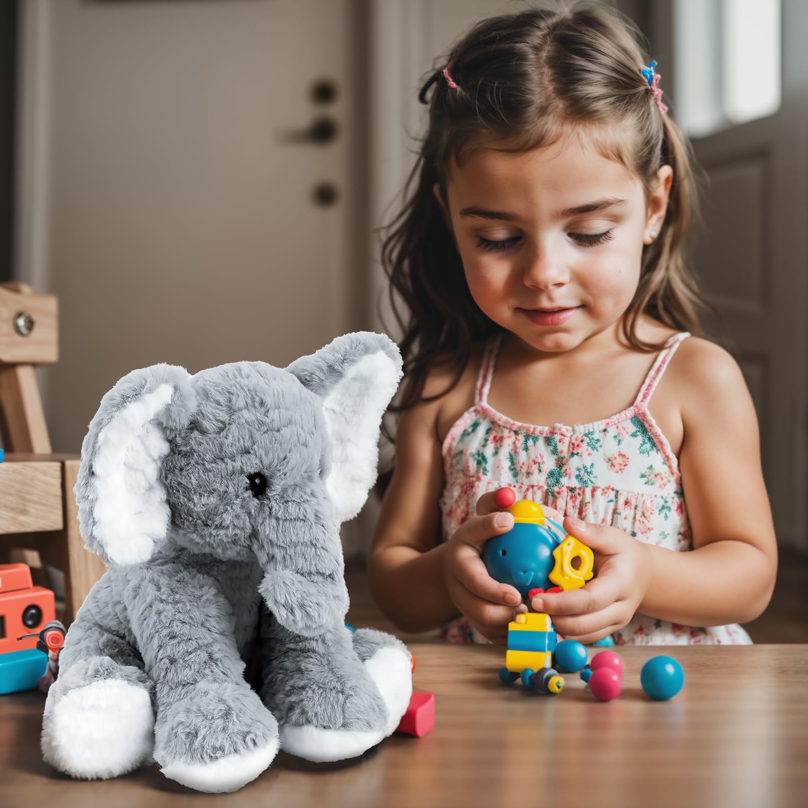 Mikee Fluffie Elephant travel companion, compact size fits bags easily.