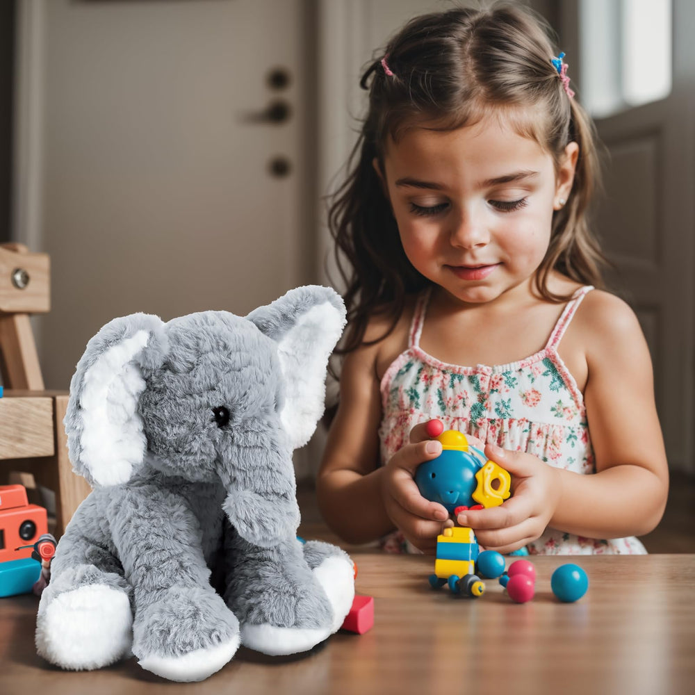 Mikee Fluffie Elephant travel companion, compact size fits bags easily.