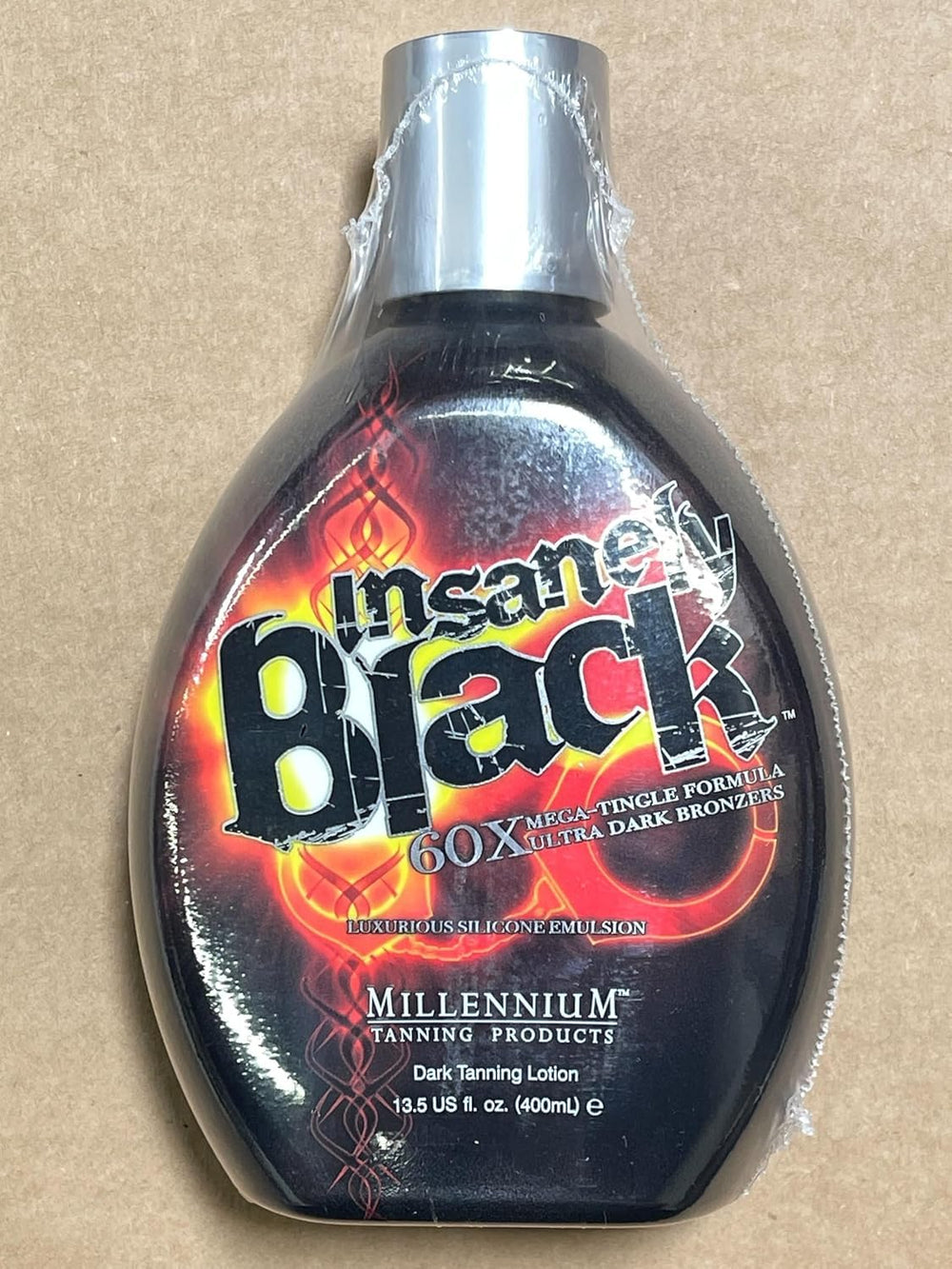 Packaging and usage shot of Millennium Insanely Black 60x 13.5 oz.