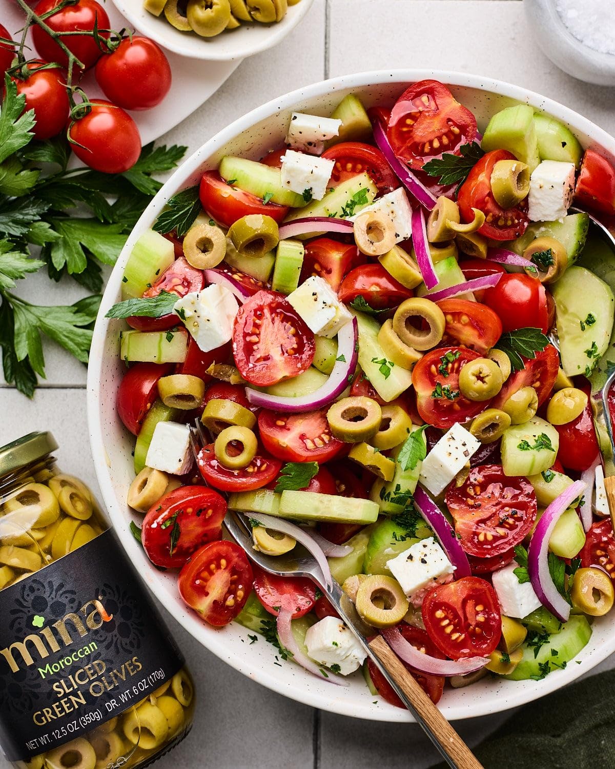 Mina Sliced Green Olives in a salad bowl adding brightness and tang