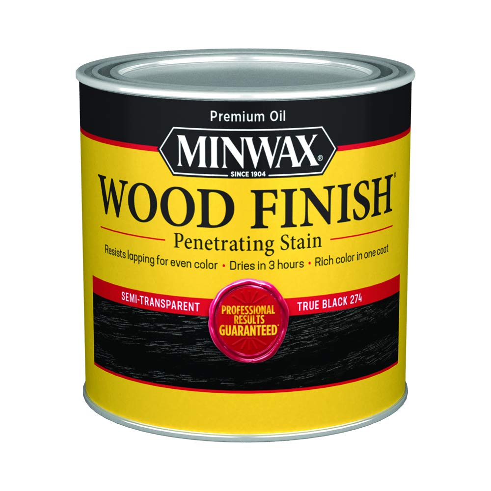 Minwax True Black stain bottle pour showing rich interior color potential