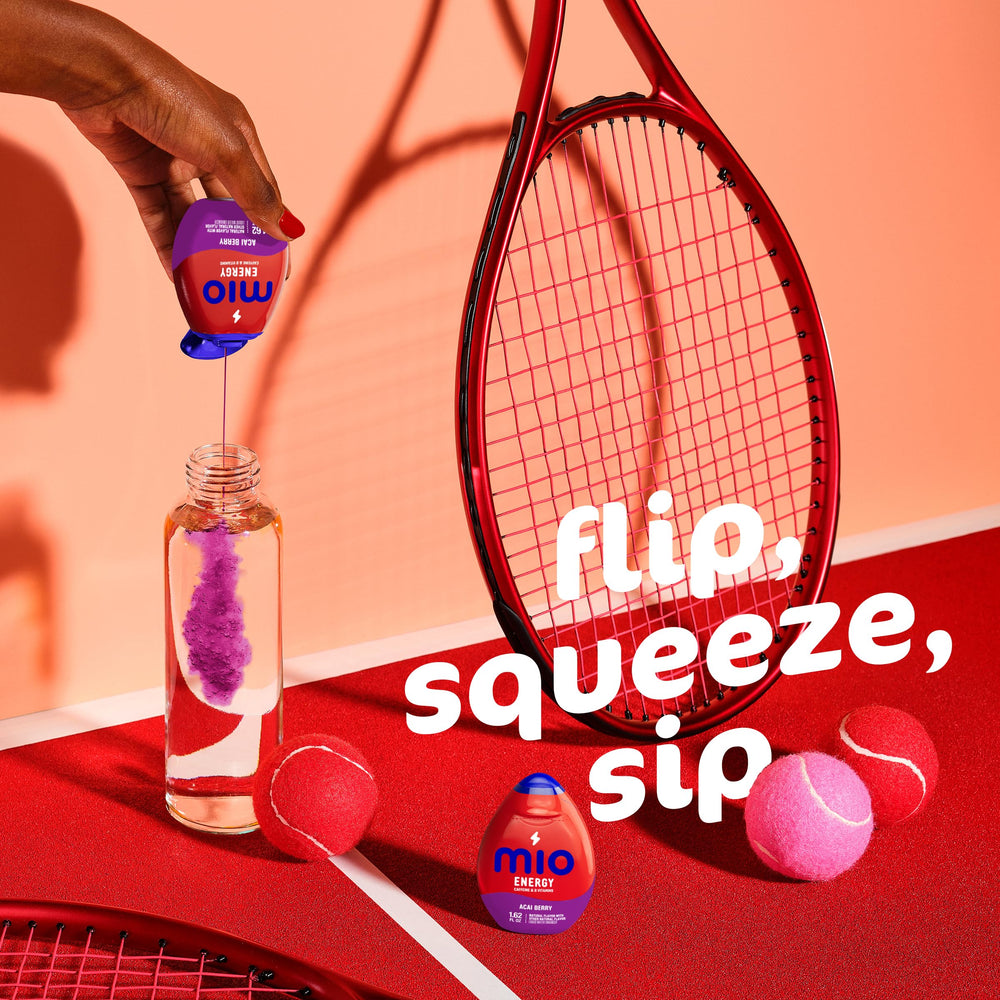 Mio Energy squeeze bottle with water—customizable flavor intensity at home or gym.