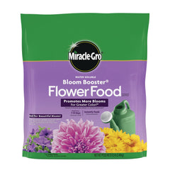 Miracle-Gro Bloom Booster dissolving in water to feed blooming plants