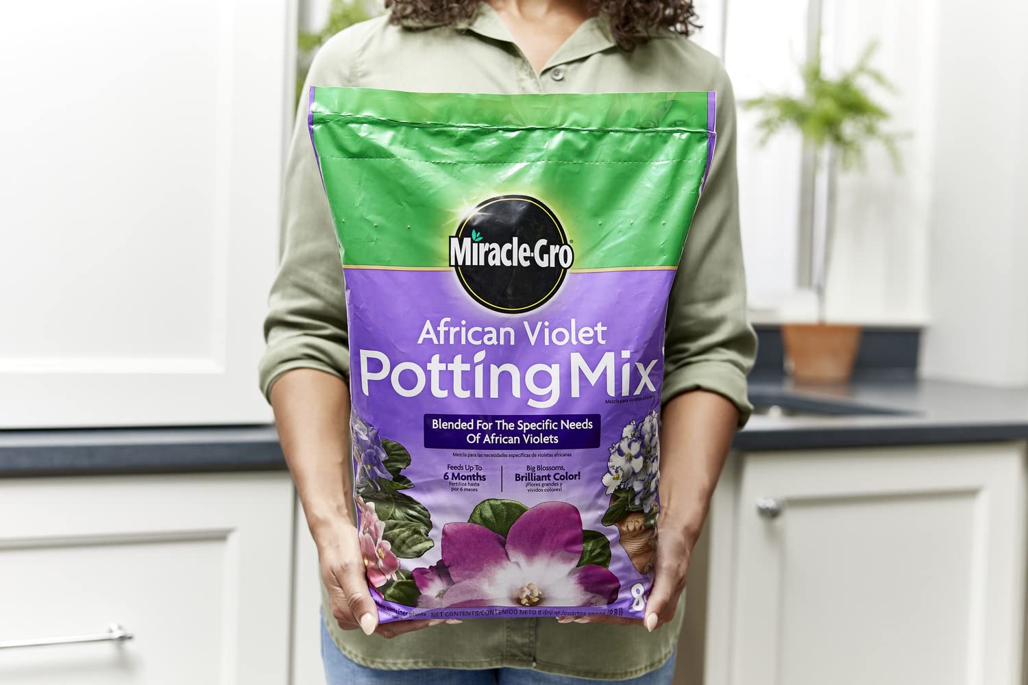 Miracle-Gro Blooming Houseplant Food paired with mix to support flowering.