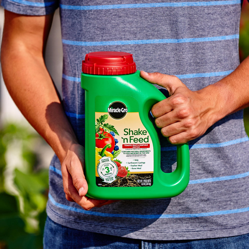 Evenly working product into the topsoil for in-ground plants