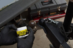 Mission Automotive tow ball lubricant on hitch connection for smoother operation during towing.