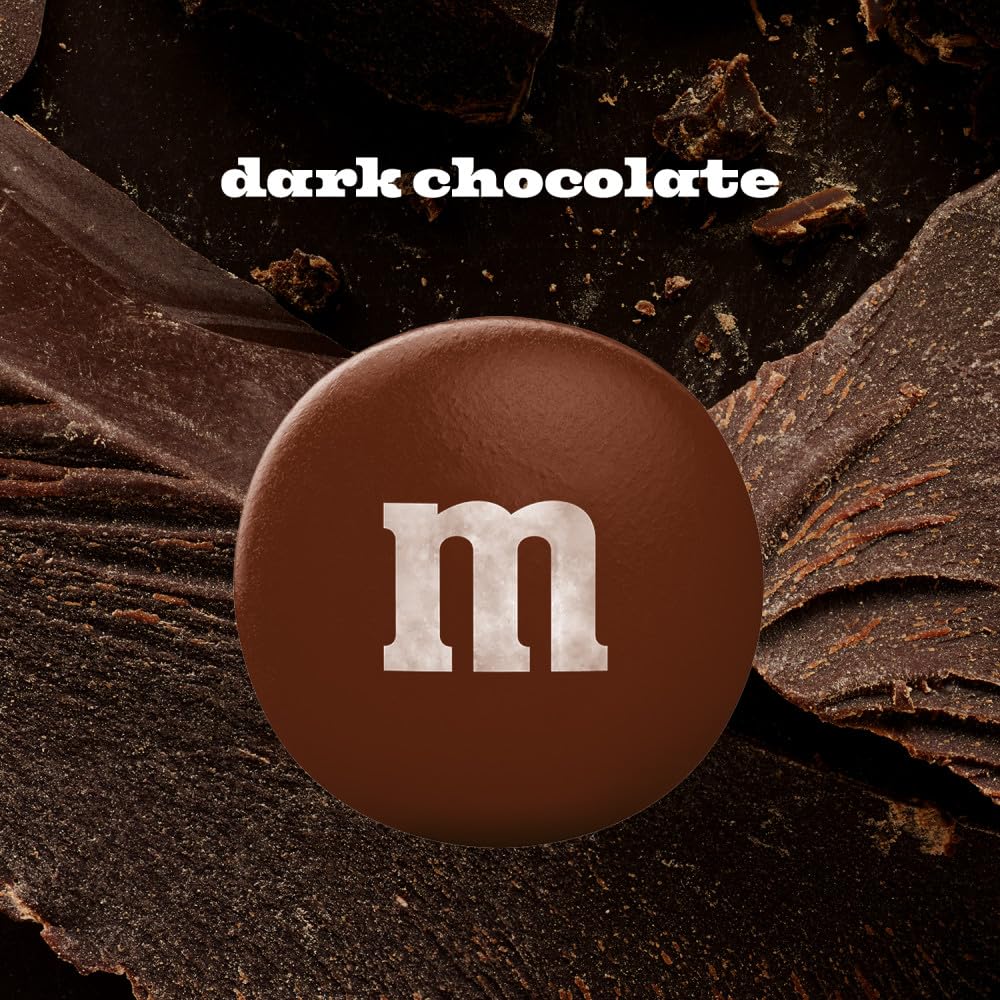 M&M'S dark chocolate candy sprinkled on popcorn for a playful movie night.
