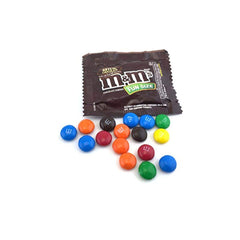 M&M's Milk Chocolate Fun Size close-up, glossy candy shells encasing creamy milk chocolate.