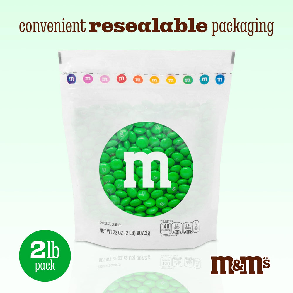 M&M'S WORLD green chocolate candies used as party decor and bowls.