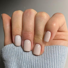Modelones milky white squoval nails close-up showing instant manicure potential and seamless fit.